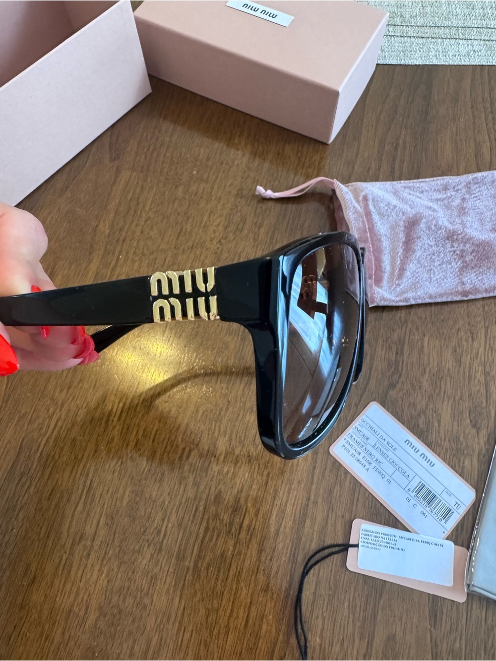 Miu Miu Black Sunglasses with Gold Logo Accents